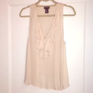 Off white sleeveless blouse
